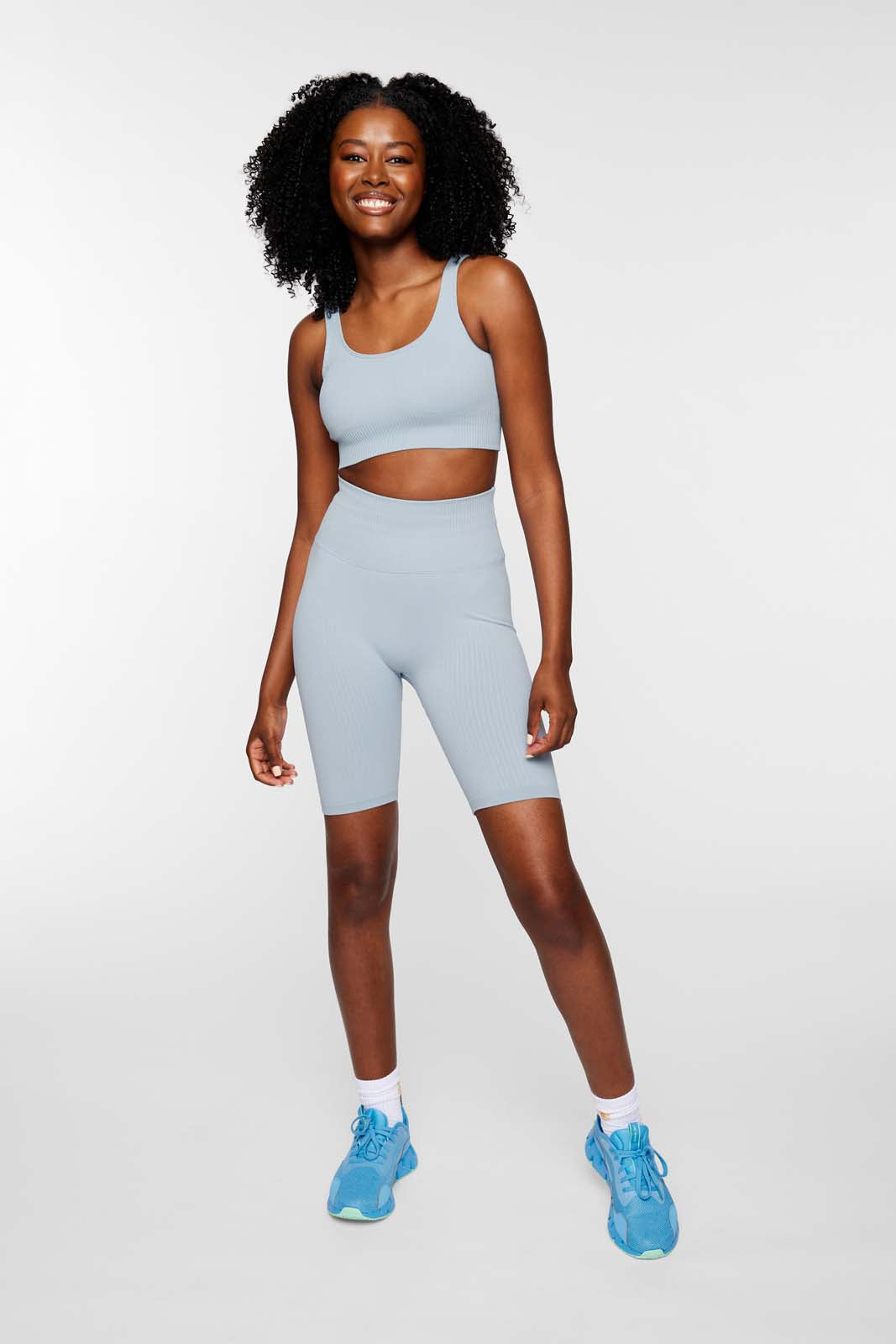 Full outfit featuring IMLND seamless ribbed sports bra in aqua– styled for gym, yoga, and everyday wear.