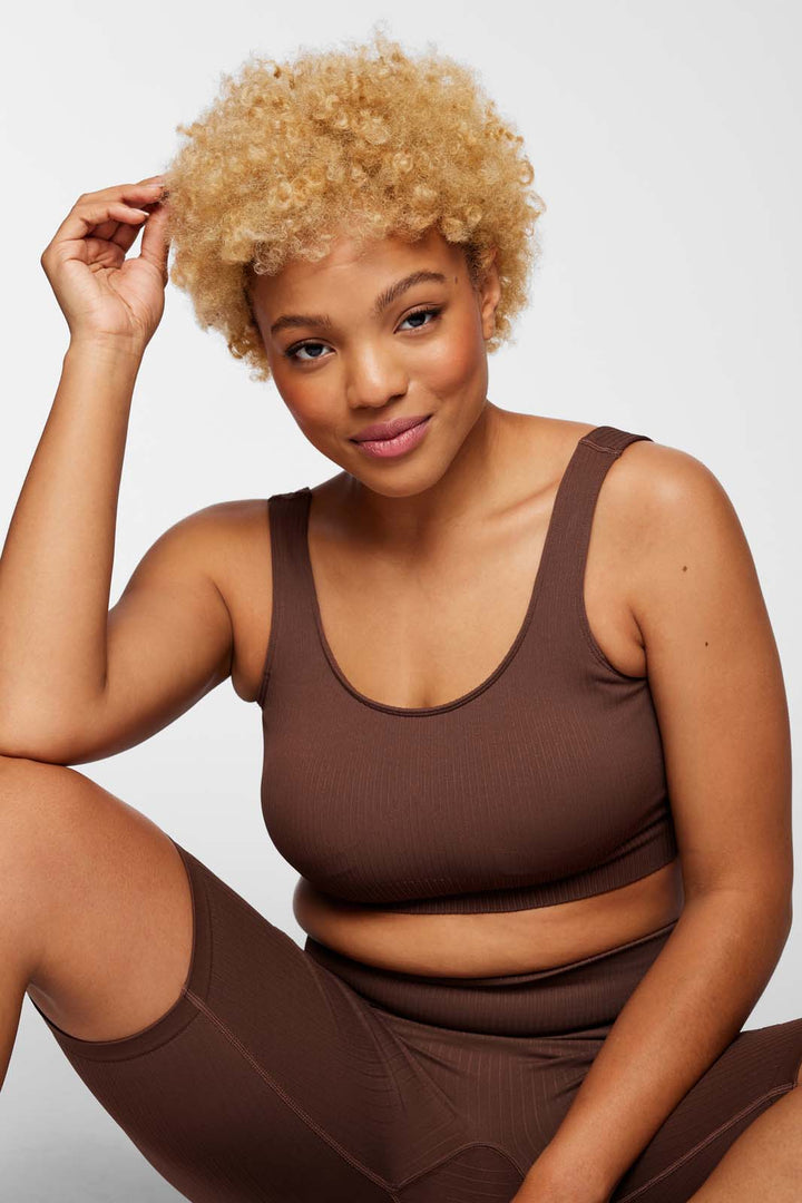 Front view of IMLND seamless ribbed sports bra in espresso– supportive and sculpting activewear for women.