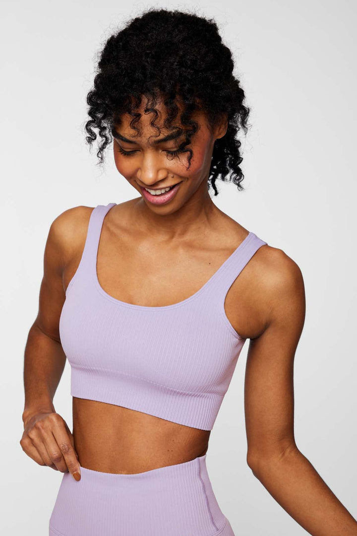 Front view of IMLND seamless ribbed sports bra in lilac– supportive and sculpting activewear for women.