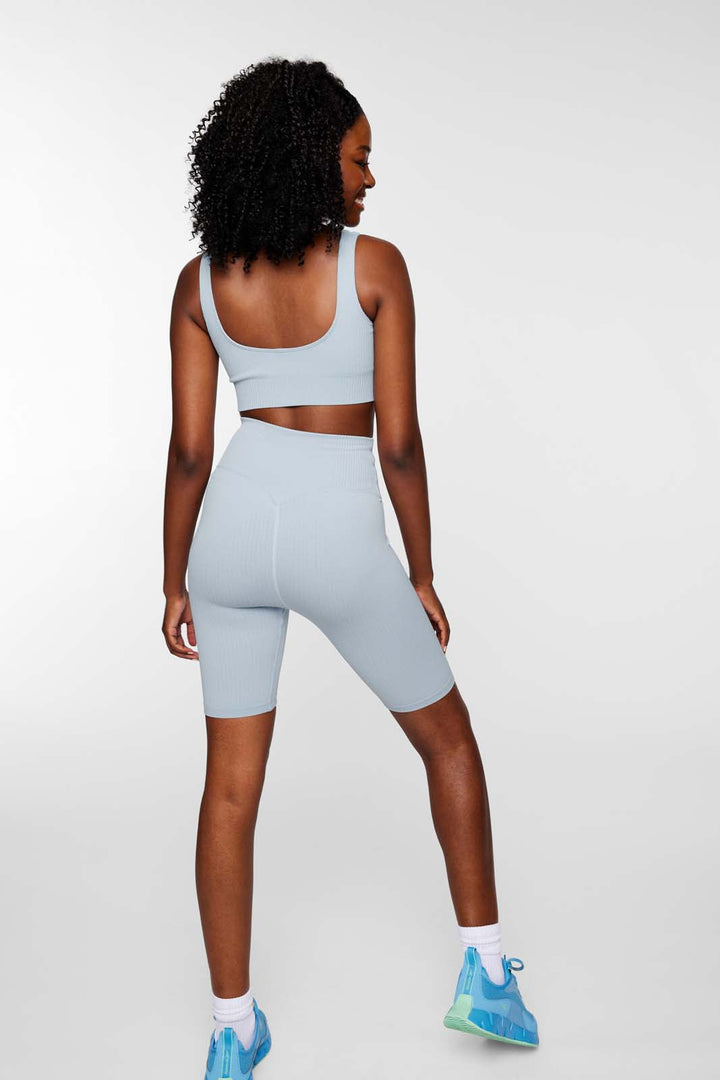 Back view of IMLND seamless ribbed sports bra in aqua– racerback design for comfort and flexibility.