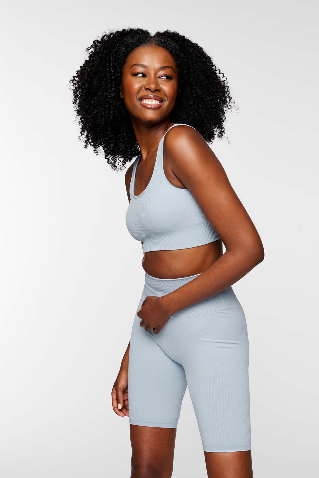 Full outfit featuring IMLND seamless ribbed sports bra in aqua – styled for gym, yoga, and everyday wear.