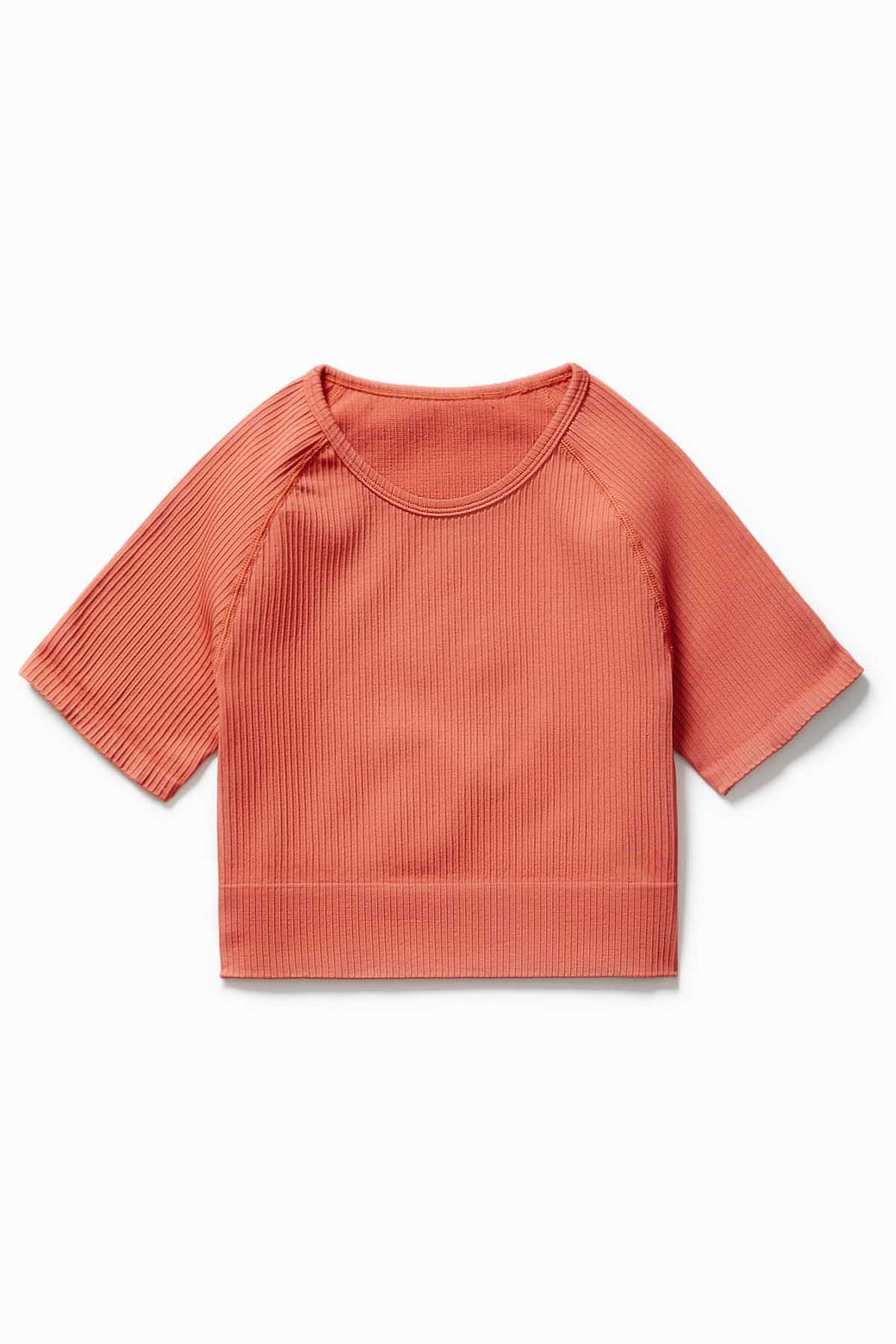 Close-up of soft ribbed fabric in Sunset colour – IMLND seamless activewear