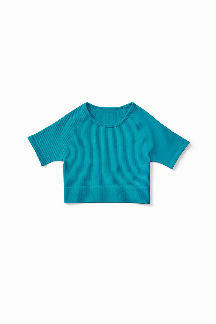 Close-up of soft ribbed fabric in Petrol  Green colour – IMLND seamless activewear